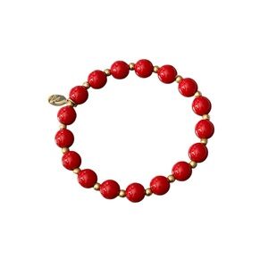 Lauren Conrad Cherry Red and Gold Toned stretch bracelet with logo tag.